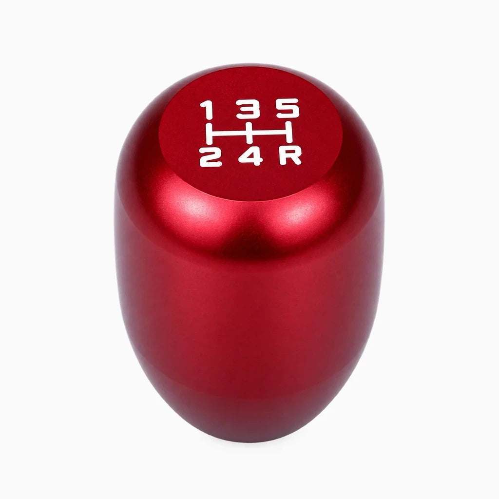 Pommeau de vitesse universel universel posé à côté du levier de vitesses, aluminium durable