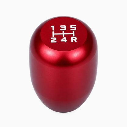 Pommeau de vitesse universel universel posé à côté du levier de vitesses, aluminium durable