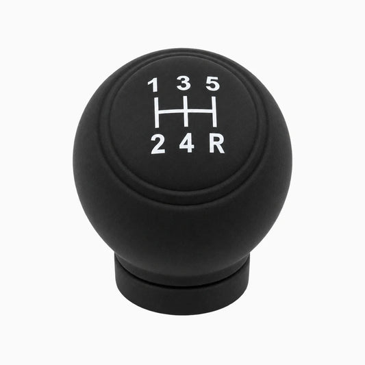 Housse silicone antidérapante enveloppant un pommeau de vitesse noir